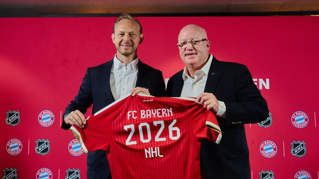 Photo featuring Rouven Kasper (board member for marketing and sales at FC Bayern München AG) and Bill Daly (Deputy Commissioner of the NHL)