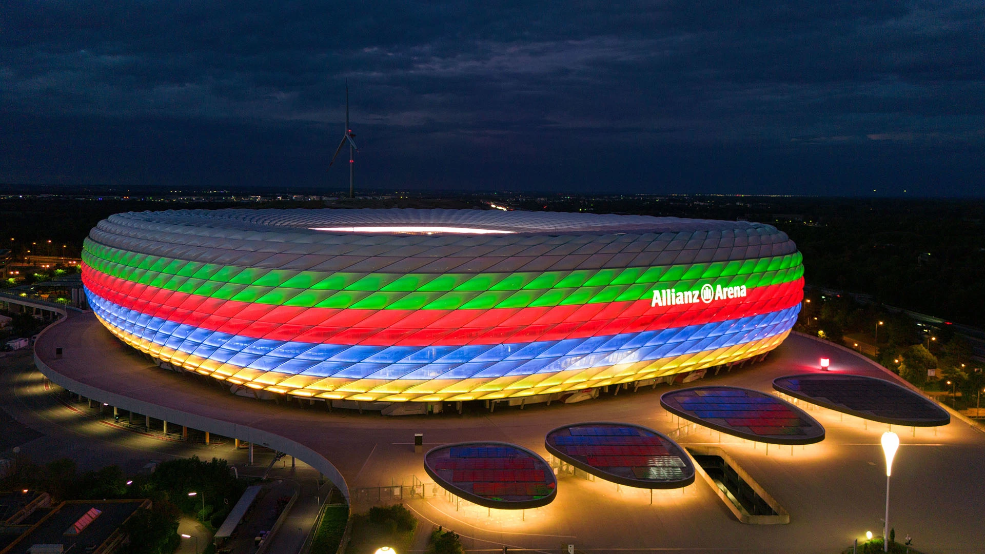 The Allianz Arena illuminated overnight in the colours of the German Olympic bid with black green, red, blue and yellow horizontal stripes on the facade