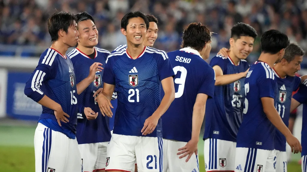 Hiroki Ito laughs with his Japanese team-mates following the international win against Ecuador.