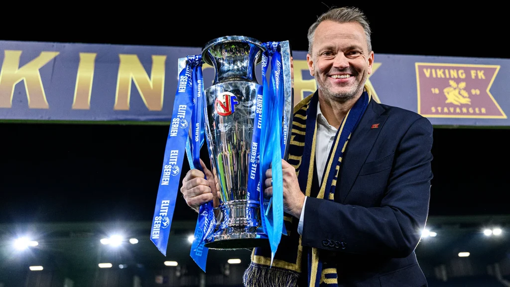 Viking sporting director Erik Nevland holding a trophy