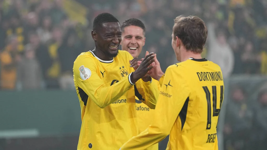 Serhou Guirassy and Maxi Beier celebrate after a BVB goal